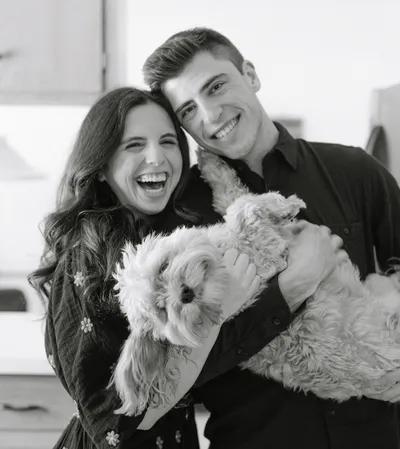 Photo of Bobby Martin with his family, including a puppy.
